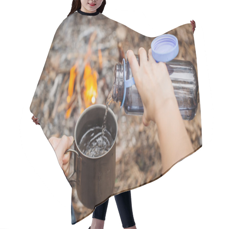 Personality  Man Traveler Pours Water From A Bottle Into A Metal Mug.  Hair Cutting Cape