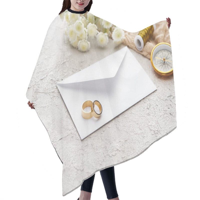 Personality  Wedding Rings On White Envelope Near Chrysanthemums, Beige Sackcloth, Spool And Golden Compass On Textured Surface  Hair Cutting Cape