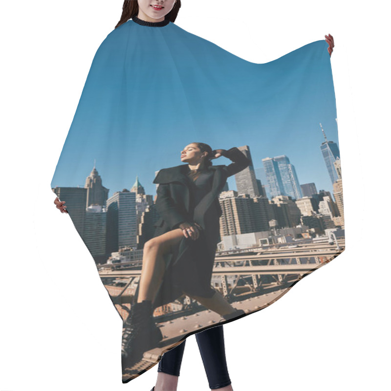 Personality  A Woman In A Black Coat Dances On Brooklyn Bridge With The NYC Skyline In The Backdrop. Hair Cutting Cape