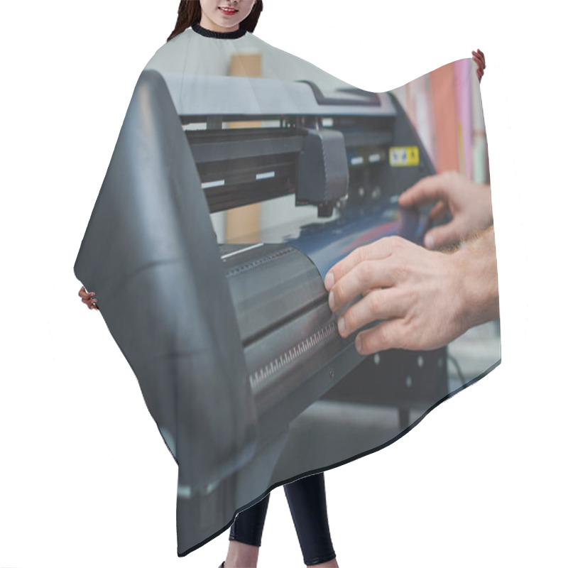 Personality  Cropped View Of Young Craftsman Holding Layer Near Screen Printing Machine While Working In Print Studio, Small Business Owner Working On Project, Creativity  Hair Cutting Cape