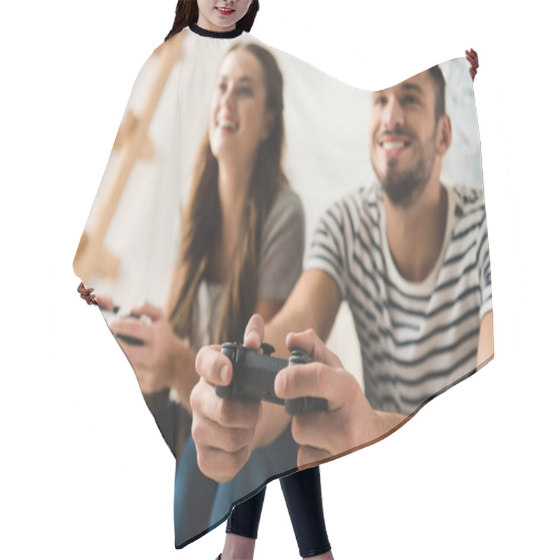 Personality  Smiling Young Couple Playing Games With Gamepads At Home Hair Cutting Cape