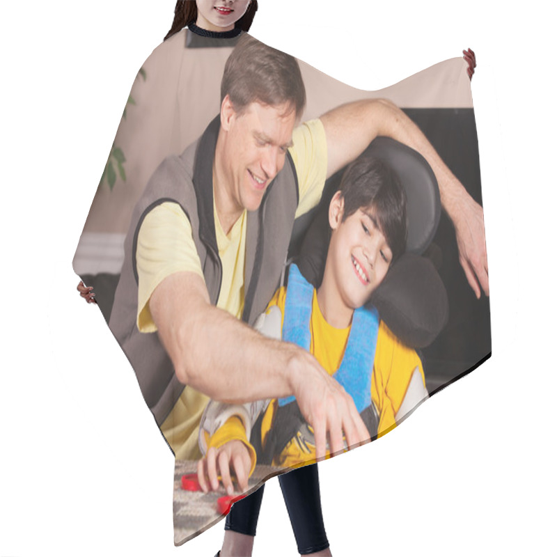 Personality  Disabled Boy In Wheelchair Playing Checkers With Father At Home Hair Cutting Cape