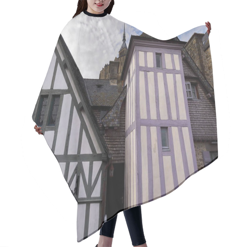 Personality  Mont-Saint-Michel, France-October 19, 2020: Half-timbered Rear Facades In White And Green, Cream And Purple Of XV Century Buildings On The Grande Rue-Main Street Overlooking The Ramparts Wall-walk. Hair Cutting Cape