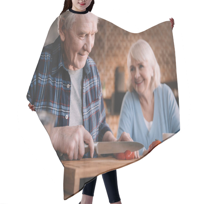 Personality  Senior Couple In Kitchen Hair Cutting Cape