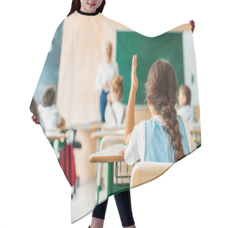 Personality  Back View Of Schoolgirl Raising Hand To Answer Teachers Question During Lesson Hair Cutting Cape