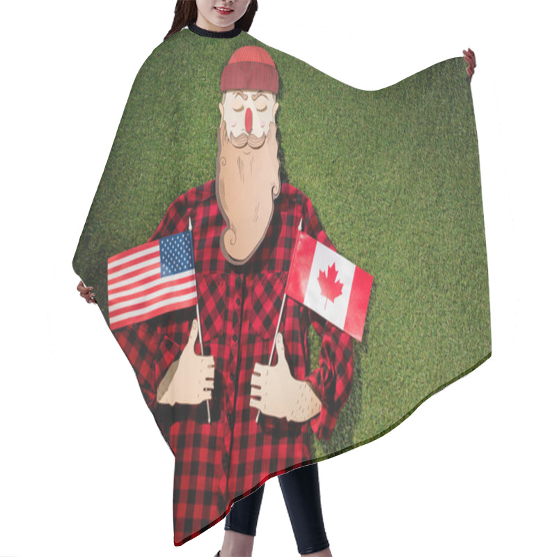 Personality  Cardboard Man In Plaid Shirt And Hat Holding Canadian And American Flags On Green Grass Background Hair Cutting Cape