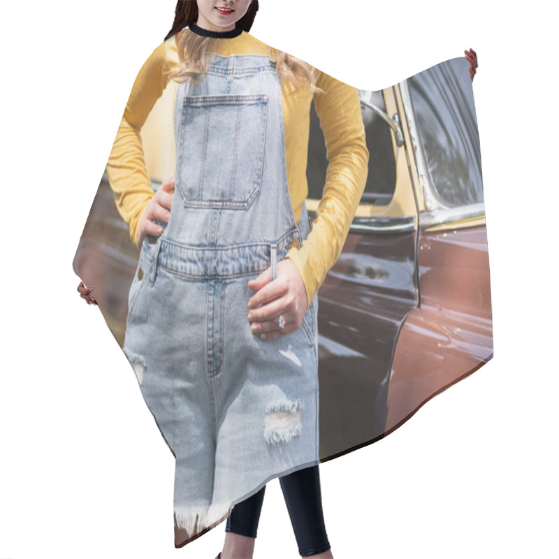 Personality  Cute Young Woman In Overalls Standing In Front Of Classic Car With Hand On Hip And Engagement Ring Hair Cutting Cape