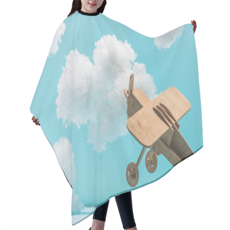 Personality  Wooden Toy Plane Flying Among White Fluffy Clouds Made Of Cotton Wool Isolated On Blue Hair Cutting Cape