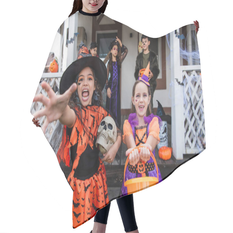 Personality  Girl In Witch Costume Screaming With Outstretched Hand Near Smiling Friend With Trick Or Treat Bucket Hair Cutting Cape