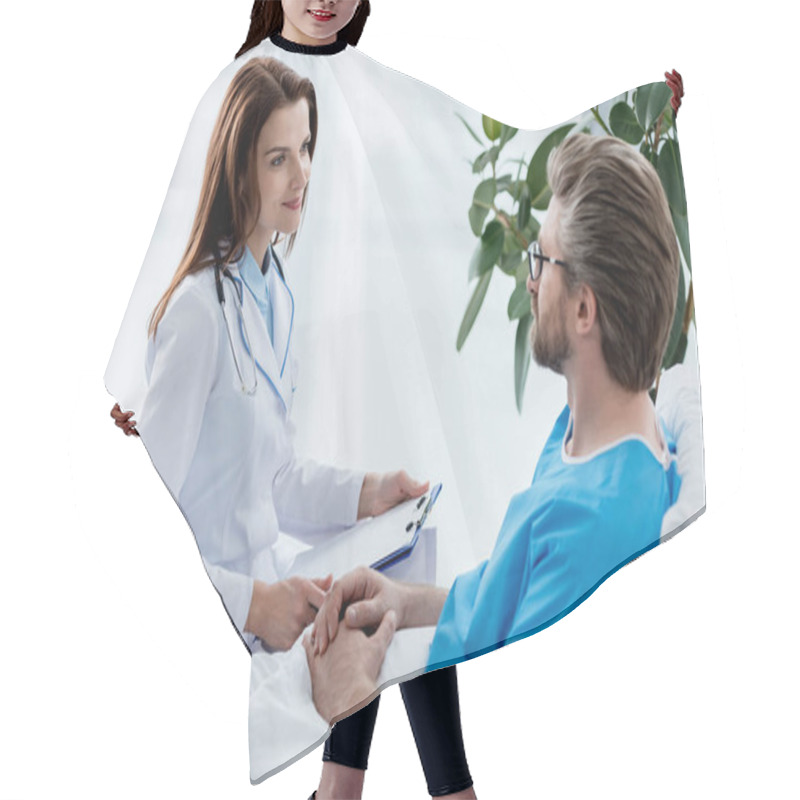 Personality  Doctor In White Coat Holding Clipboard And Looking At Patient In Hospital  Hair Cutting Cape