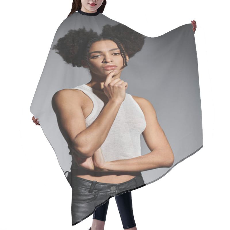 Personality  A Young African American Woman In A White Tank Top Poses Against A Grey Background, Showcasing A Trendy And Stylish Look. Hair Cutting Cape