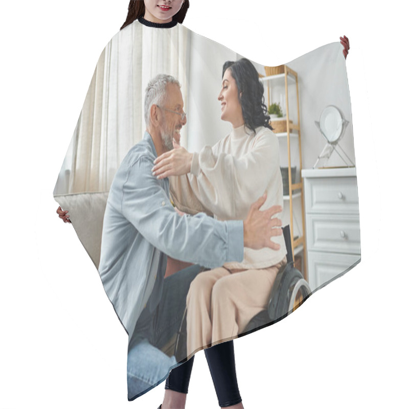 Personality  A Woman In A Wheelchair Hugs Her Husband, Showing Love And Support In Their Living Room. Hair Cutting Cape