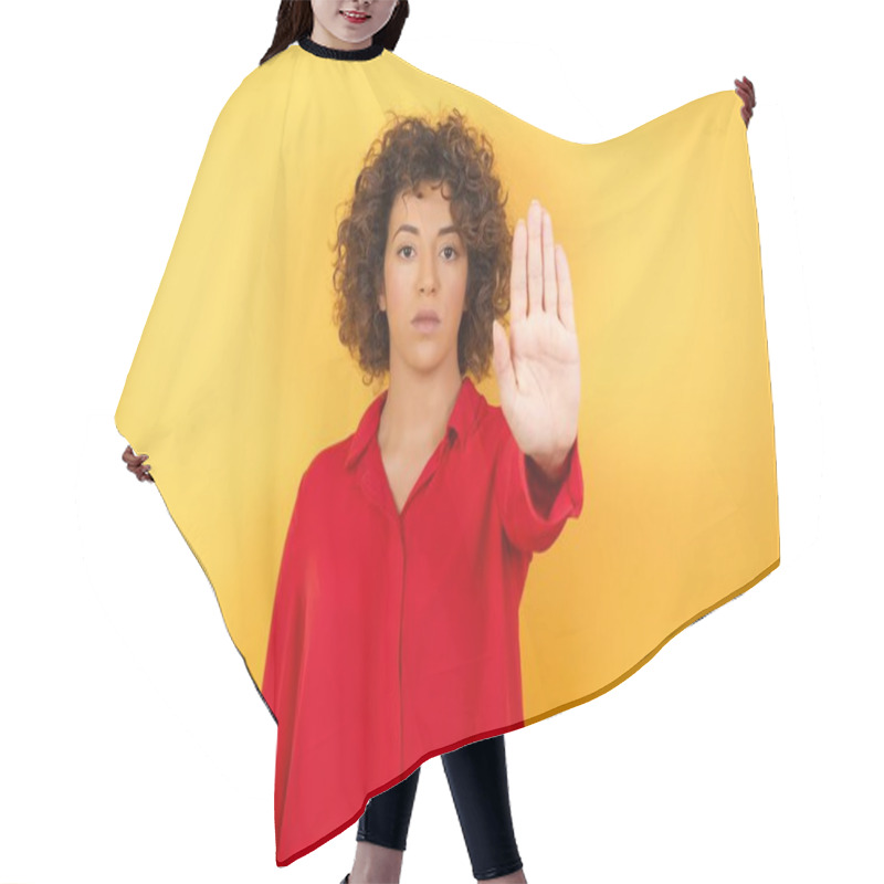 Personality  Beautiful Young Woman  Doing Stop Gesture With Palm Of The Hand. Warning Expression With Negative And Serious Gesture On The Face Isolated Over Yellow Background. Hair Cutting Cape