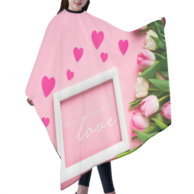 Personality  Top View Of White Frame With Do All Thing With Love Illustration Near Tulips And Hearts On Pink Background Hair Cutting Cape