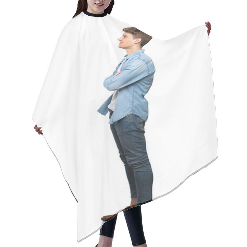 Personality  A Full-length Shot Of A Handsome Young Man In Lateral Position Over Isolated White Background Hair Cutting Cape