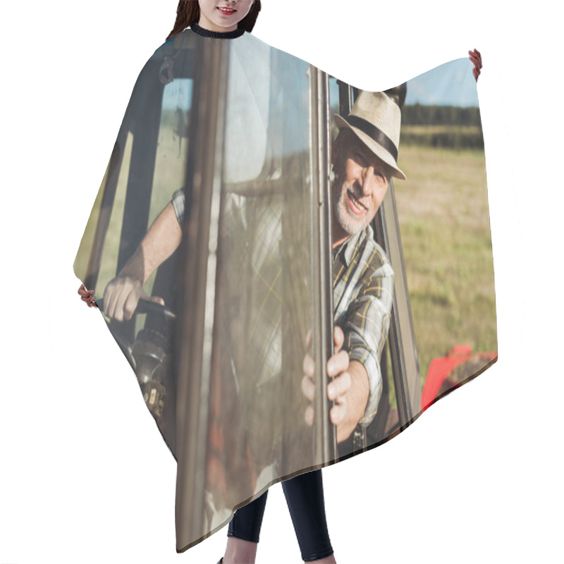 Personality  Selective Focus Of Cheerful Senior Farmer Driving Tractor  Hair Cutting Cape