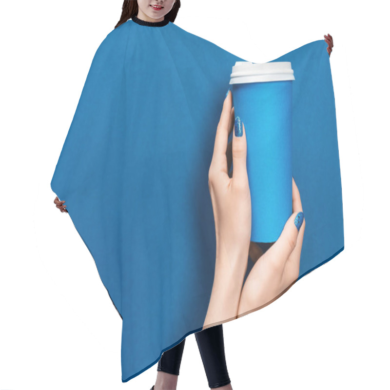 Personality  Cropped View Of Woman Holding Paper Cup On Blue Background  Hair Cutting Cape