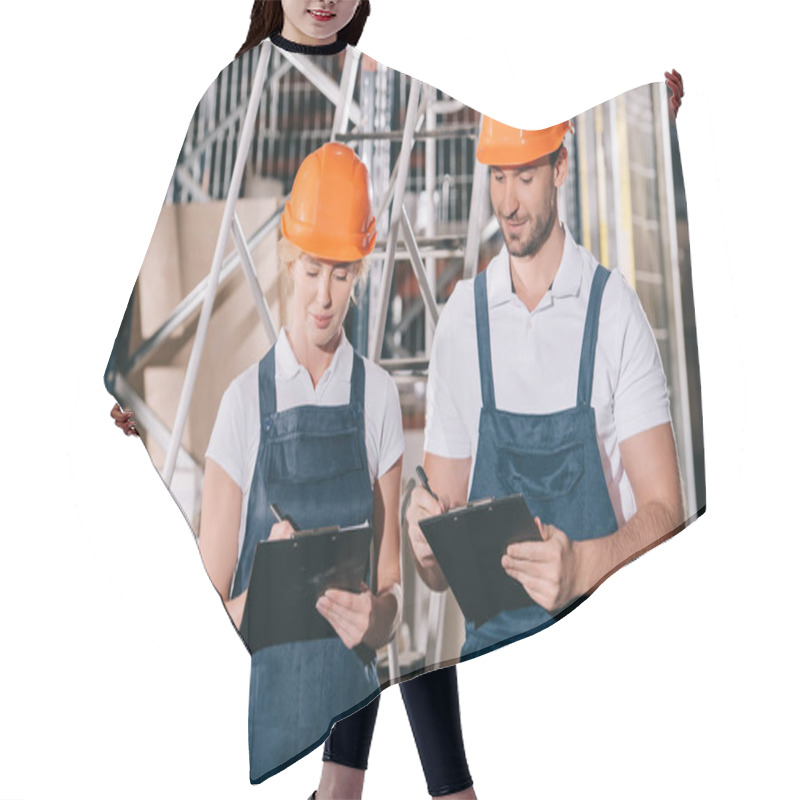 Personality  Positive Warehouse Workers In Overalls And Helmets Writing On Clipboards Hair Cutting Cape