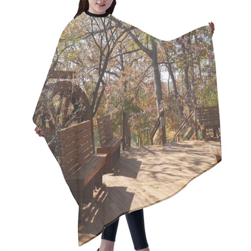 Personality  Wide Shot Of A Wooden Walkway With Benches And Working Waterwheel At A Park Hair Cutting Cape