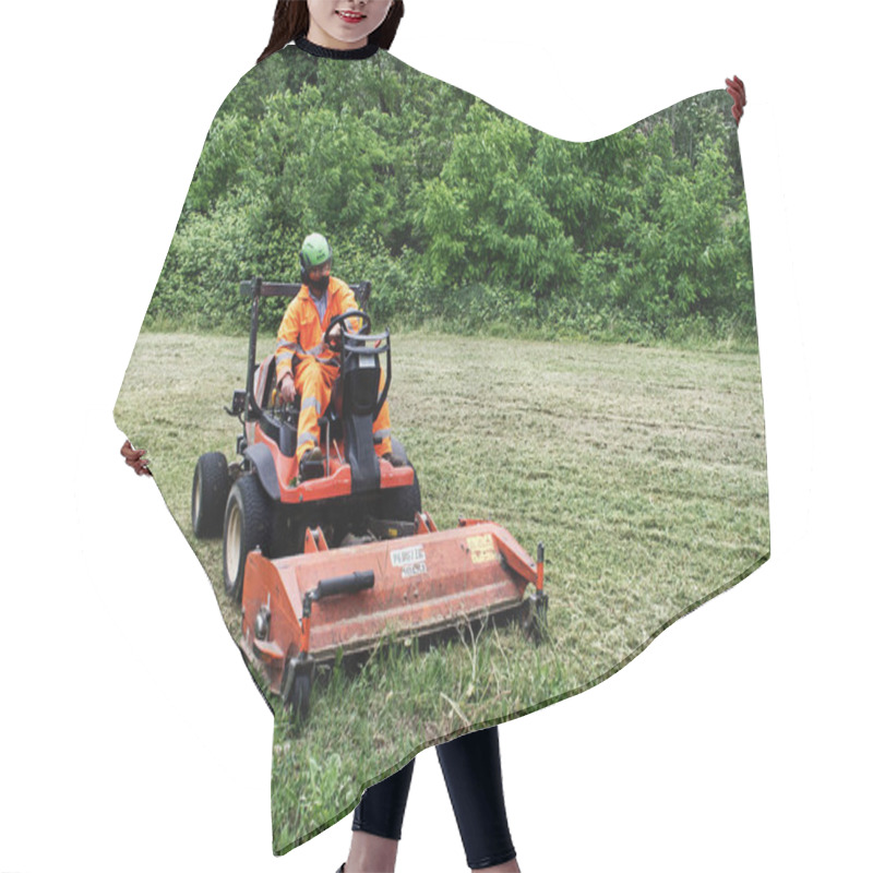 Personality  Bologna / Italy - May 15, 2020: Municipal Employee With A Tractor Mows The Grass In Urban Park Hair Cutting Cape