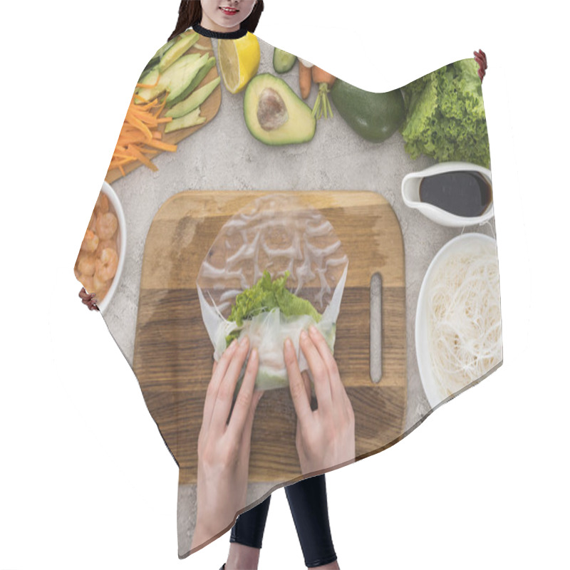 Personality  Top View Of Woman Making Roll On Cutting Board Among Ingredients  Hair Cutting Cape