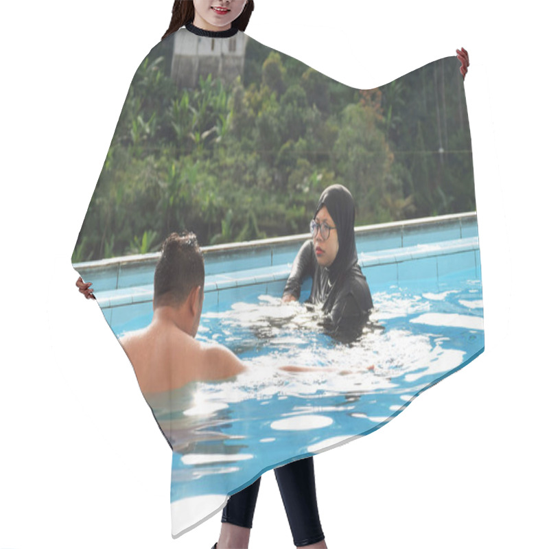 Personality  Tegal, Indonesia - July 07, 2024 : A Husband And Wife Are At The Swimming Pool Of A Villa In The Guci. View With Pine Forest Background Hair Cutting Cape