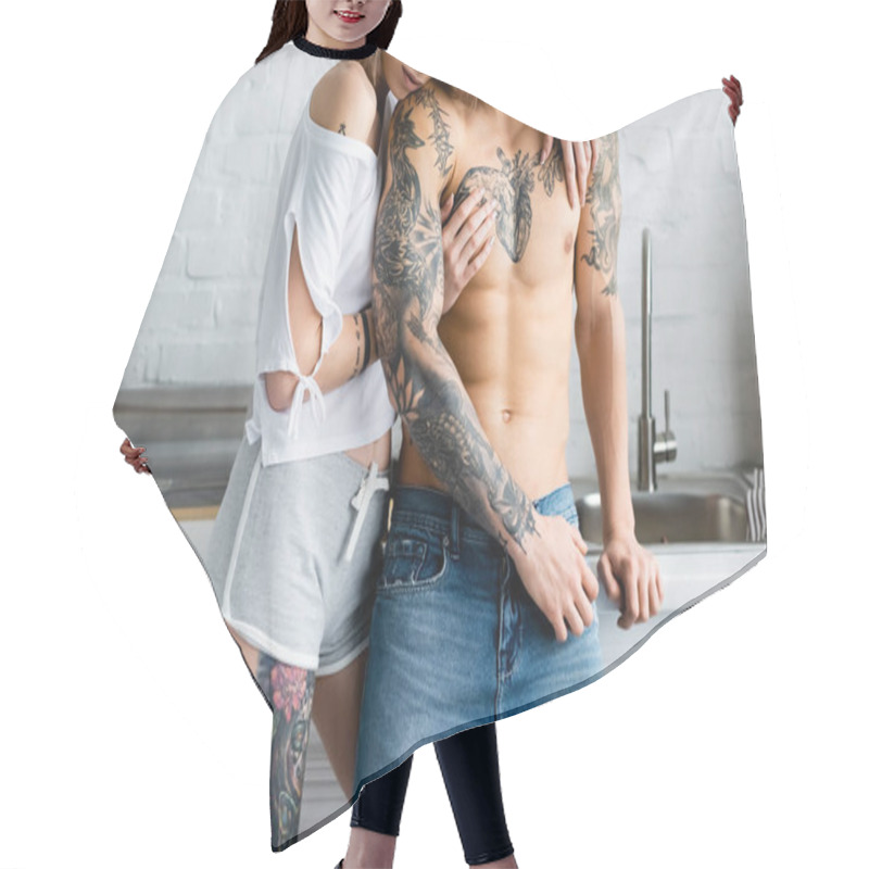 Personality  Cropped View Of Woman Embracing Muscular Tattooed Boyfriend In Kitchen  Hair Cutting Cape