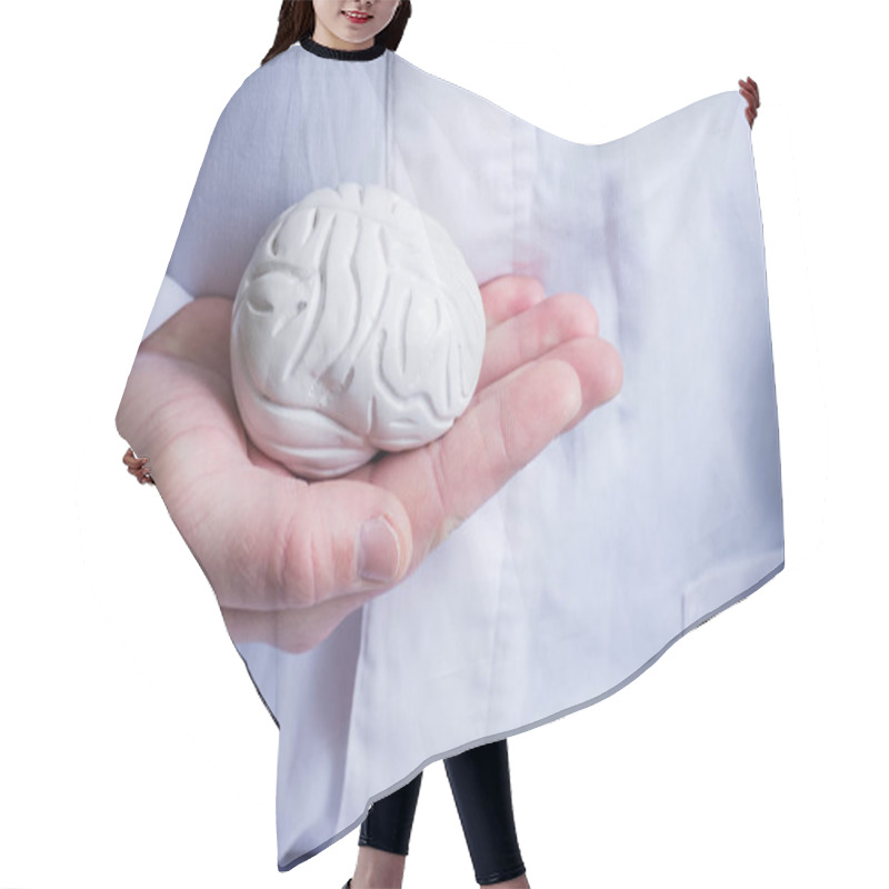 Personality  Doctor In White Coat Holds In His Hand In Palm Of Anatomical Model Of Human Brain. Concept Photo Of Diagnosis, Treatment And Prevention Of Diseases Of Brain, Nerves And Nervous System Hair Cutting Cape