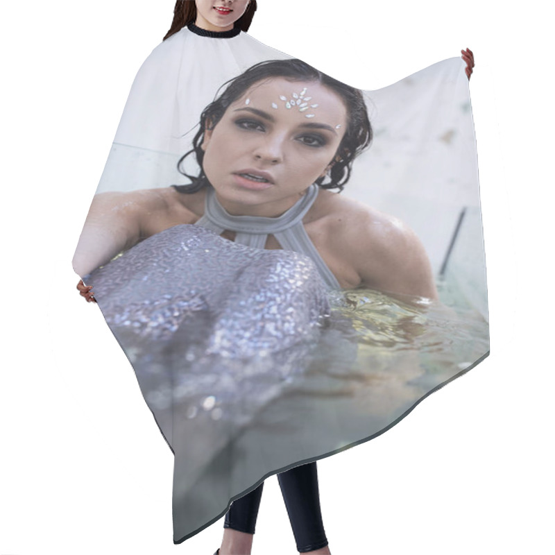 Personality  A Young Woman With Dark Hair And A Shimmering Tail Gazes Into The Camera, Submerged In A Water Tank. Hair Cutting Cape