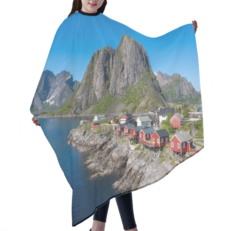 Personality  Charming Red Cabins Dot The Rocky Coastline, Surrounded By Majestic Mountains And A Serene Fjord Under A Clear Blue Sky. Hamnoy Fishing Village Lofoten, Norway Hair Cutting Cape