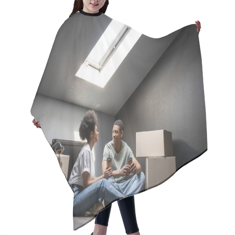 Personality  Joyful African American Couple With Coffee To Go Talking Near Carton Boxes On Attic In New House Hair Cutting Cape