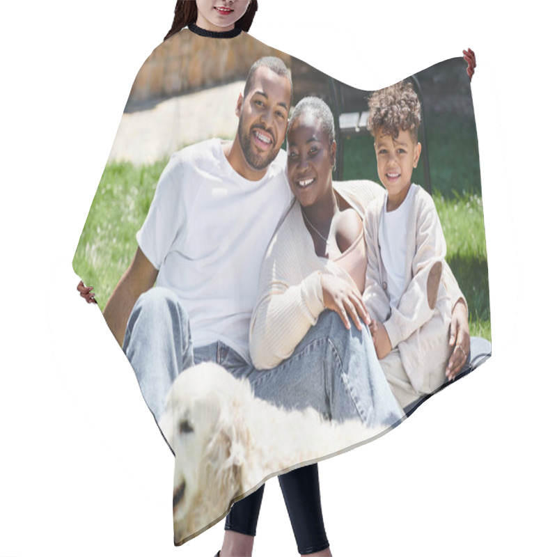 Personality  Family Portrait Of Positive African American Family Looking At Camera And Sitting On Lawn Near Dog Hair Cutting Cape