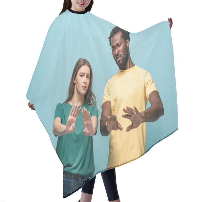 Personality  Confused Interracial Couple Showing No Gesture On Blue Background Hair Cutting Cape