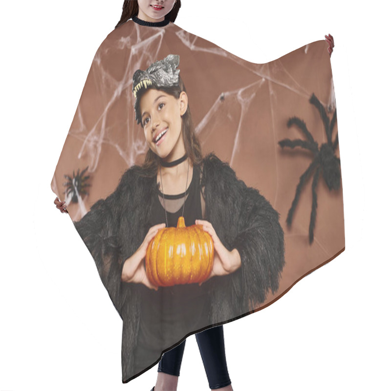 Personality  Smiley Preteen Girl Holding Pumpkin In Her Hands On Brown Backdrop, Halloween Concept Hair Cutting Cape