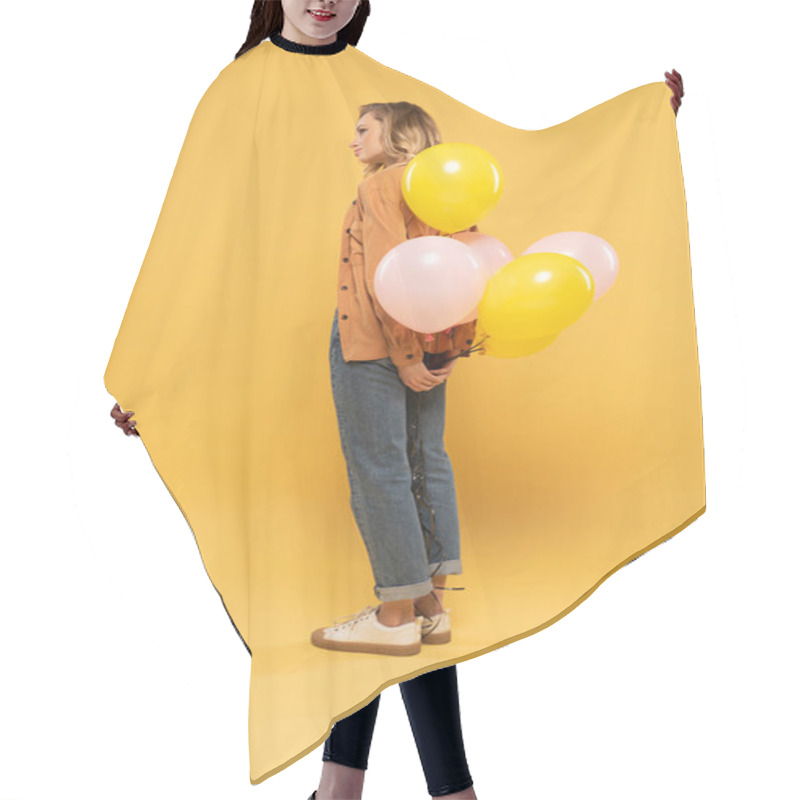 Personality  Side View Of Blonde Woman Holding Balloons On Yellow Background Hair Cutting Cape