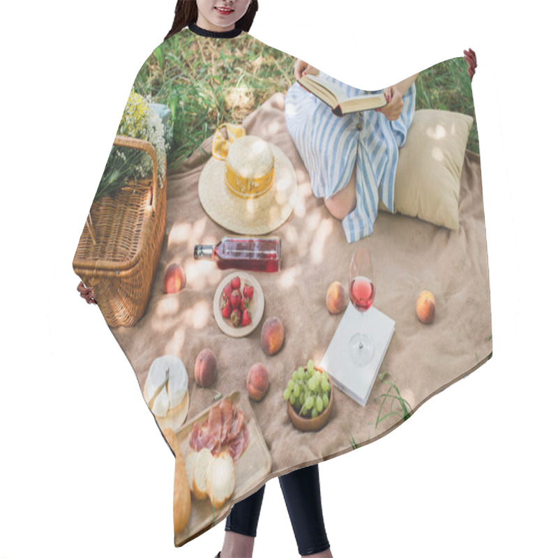 Personality  Cropped View Of Young Woman Holding Book During Picnic With Wine And Food In Park  Hair Cutting Cape