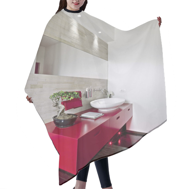 Personality  Interior Shot Of A Modern Bathroom In Foreground The Red Washbasin Cabinet The Floor Is Made Of Wood Hair Cutting Cape