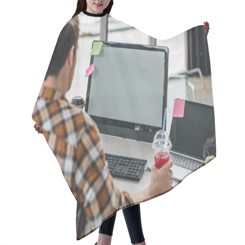 Personality  Back View Of Young Programmer Holding Glass Of Juice While Sitting At Workplace Hair Cutting Cape