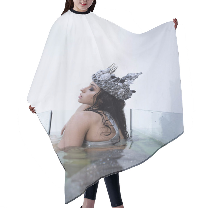 Personality  A Young Woman With Long Dark Hair, Wearing A Seashell Crown, Is Submerged In Water In A Glass Tank, With A Thoughtful Expression. Hair Cutting Cape