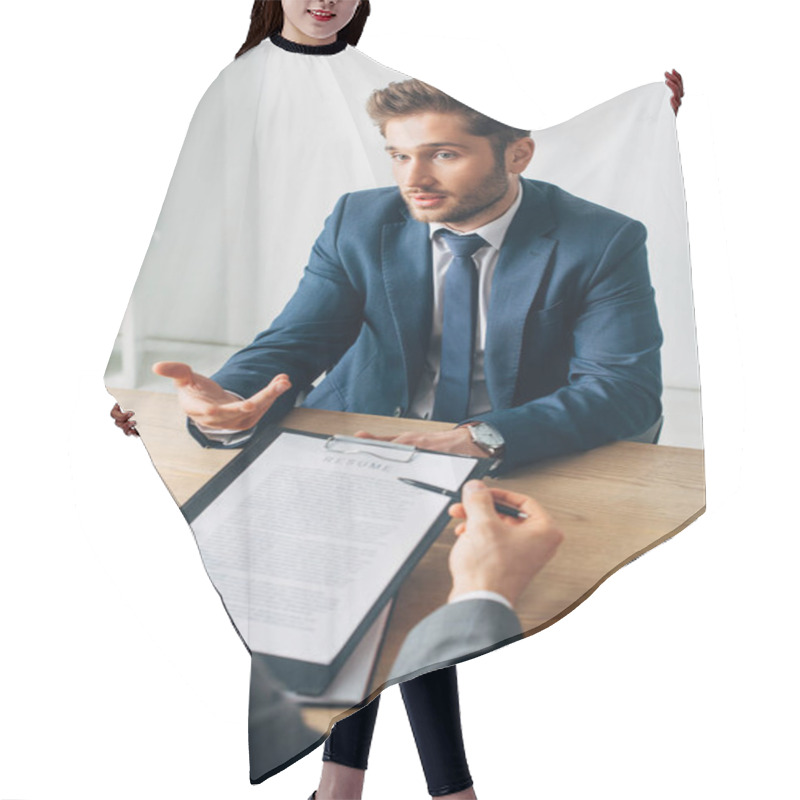 Personality  Selective Focus Of Employee In Suit Looking At Recruiter With Resume At Table Hair Cutting Cape