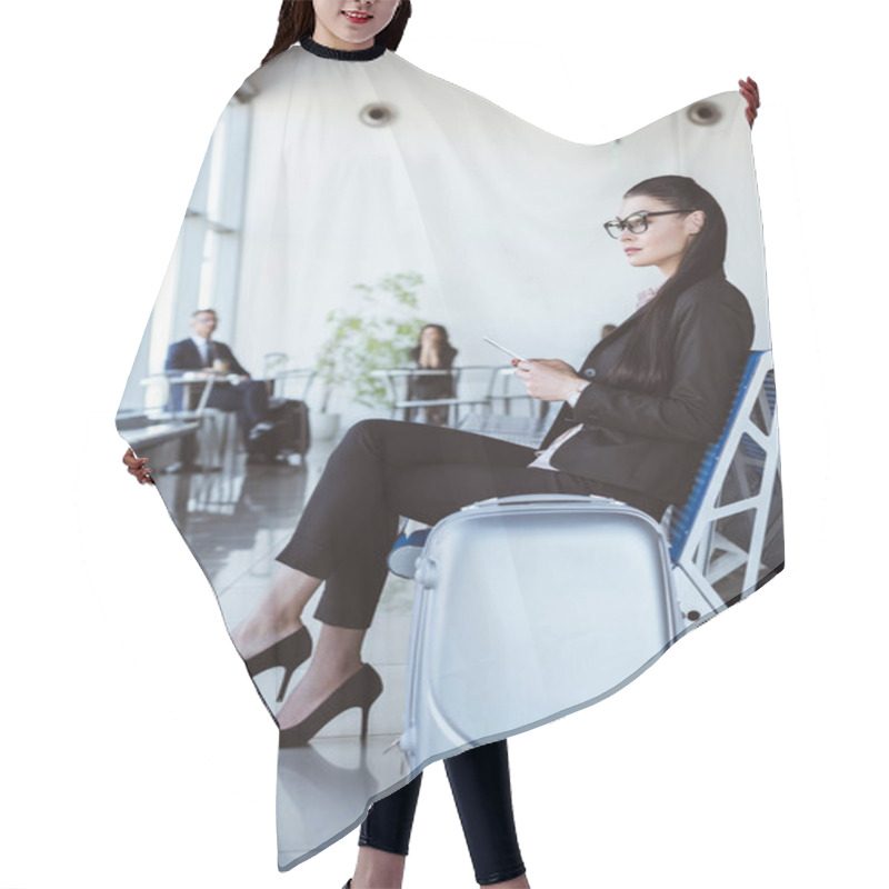 Personality  Young Businesswoman In Glasses With Smartphone Sitting At Departure Lounge In Airport Hair Cutting Cape