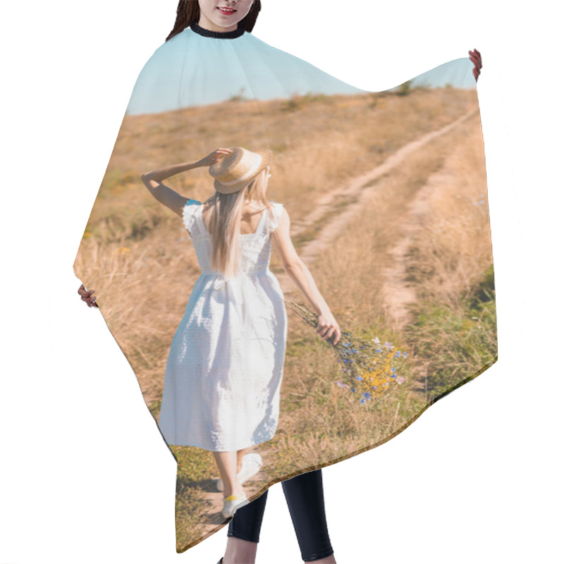 Personality  Back View Of Young Woman In White Dress Touching Straw Hat While Walking On Road In Field With Bouquet Of Wildflowers Hair Cutting Cape