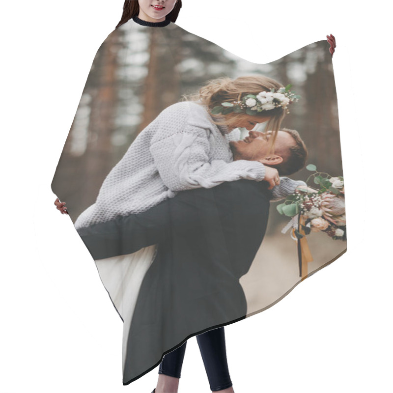 Personality  Newlyweds Have A Fun And Embrace At Forest Path In A Coniferous Forest Among Pine Trees. Closeup. Hair Cutting Cape