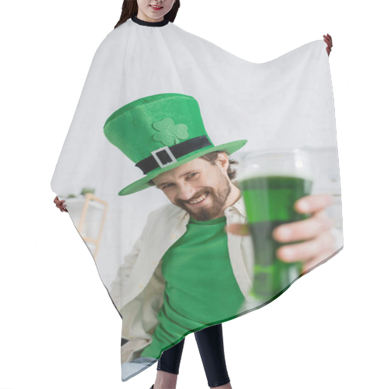 Personality  Smiling Man In Hat Holding Blurred Green Beer During Saint Patrick Celebration At Home  Hair Cutting Cape