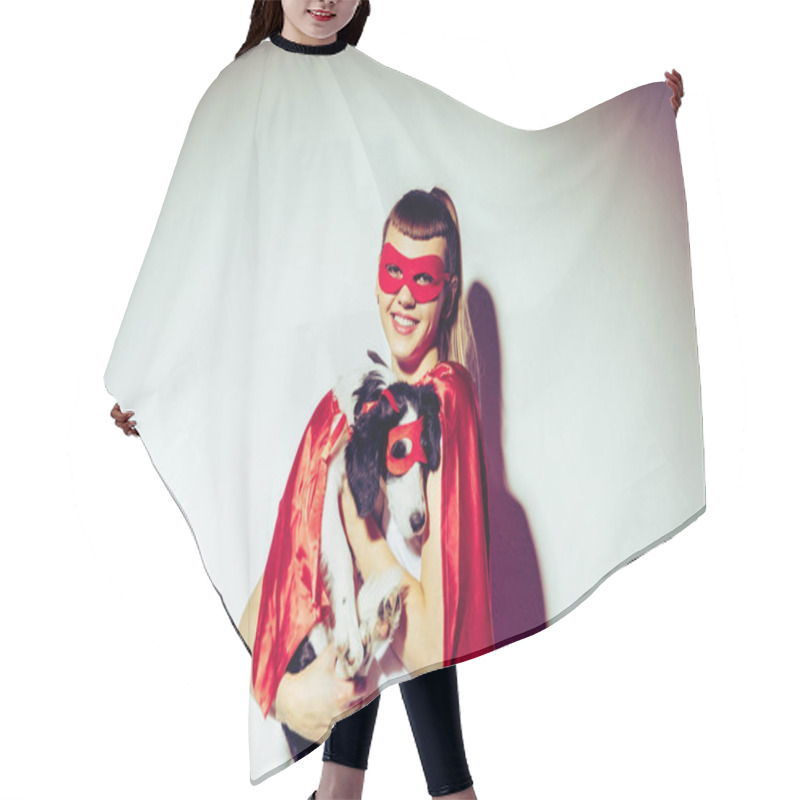 Personality  Portrait Of Smiling Woman Holding Puppy In Superhero Costume Hair Cutting Cape