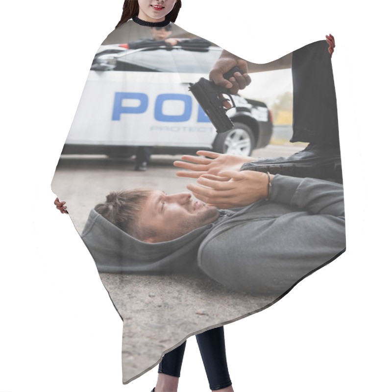 Personality  African American Police Officer Aiming With Pistol At Scared Offender Lying On Street With Blurred Patrol Car On Background Hair Cutting Cape