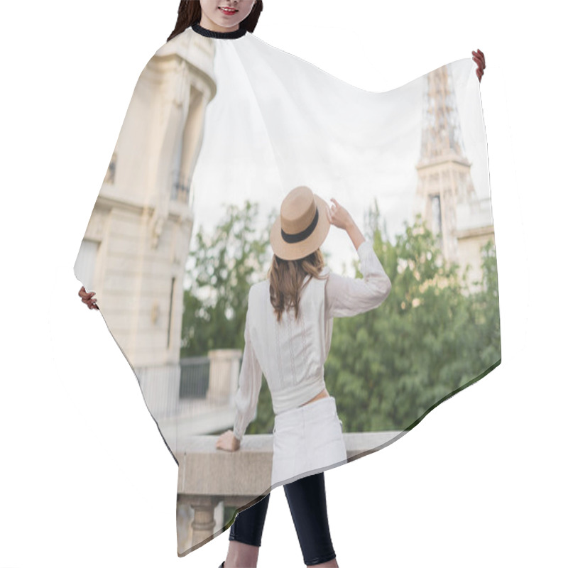 Personality  Back View Of Stylish Woman Holding Sun Hat With Eiffel Tower At Background In Paris  Hair Cutting Cape