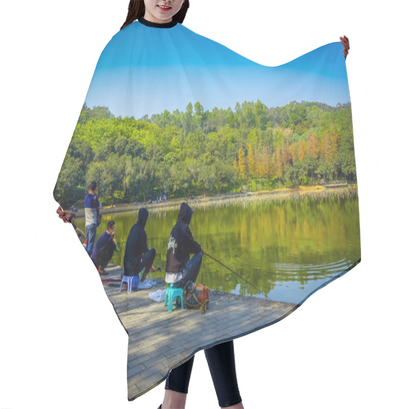 Personality  SHENZEN, CHINA - 29 JANUARY, 2017: Inside Lian Hua Shan Park, Large Recreational Area, People Sitting While Fishing In Water Lake Sorrounded By Trees, Beautiful Blue Sky, Hair Cutting Cape