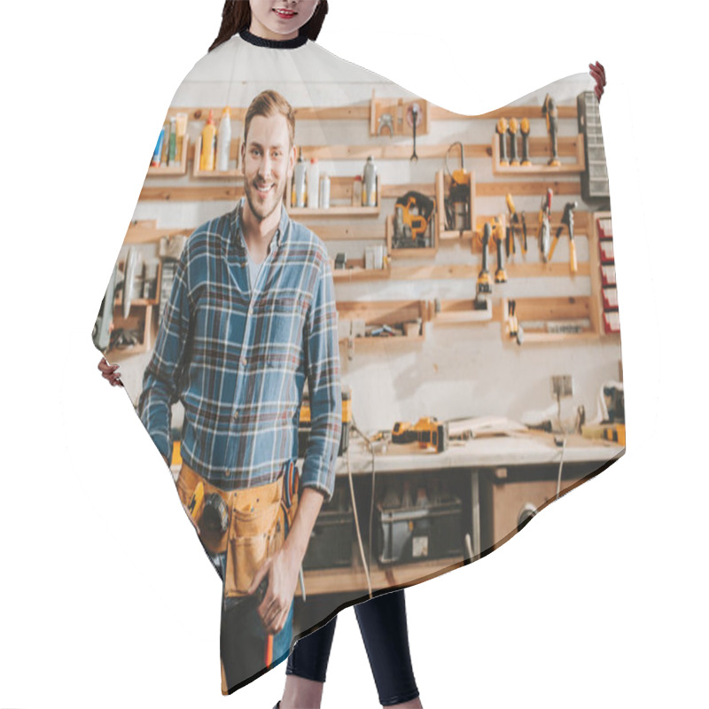 Personality  Cheerful Carpenter In Apron Standing And Touching Tool Belt In Workshop  Hair Cutting Cape