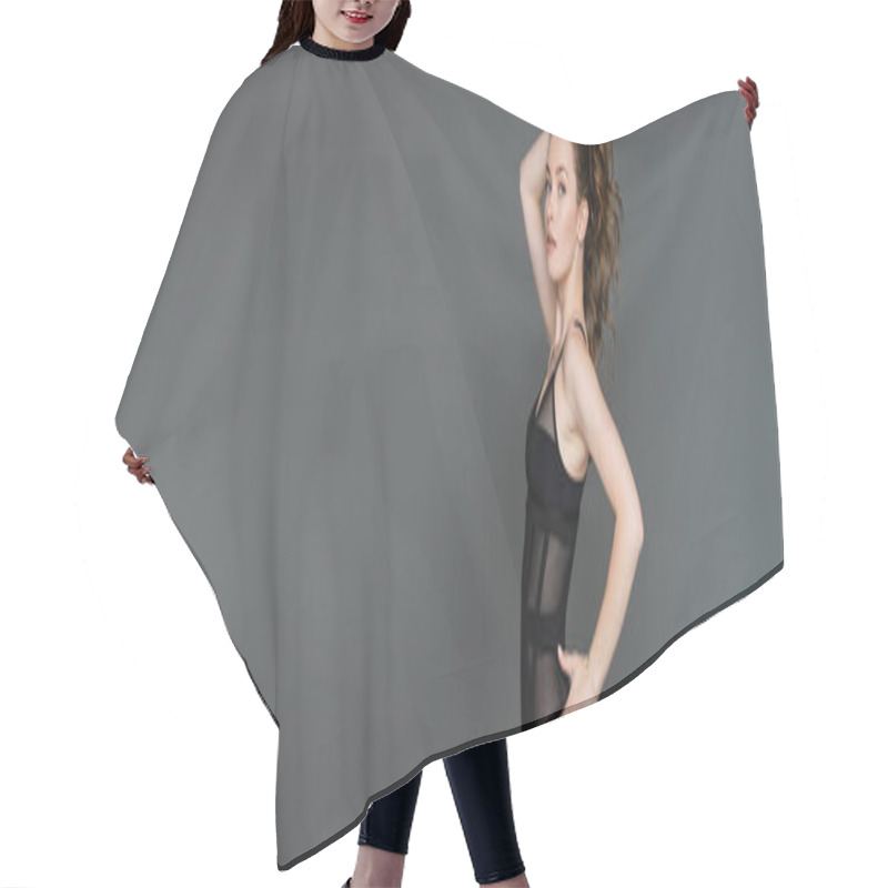 Personality  Fashionable And Sexy Young Woman With Natural Makeup And Slim Body Touching Hair And Holding Hand On Hip While Looking At Camera Isolated On Grey With Copy Space, Form-fitting, Banner  Hair Cutting Cape